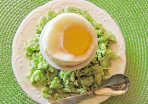 Green Scrambled Eggs Surrounding a Soft Boiled Egg