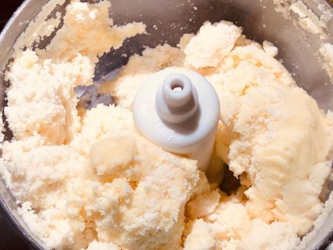 Flour, butter, Egg yolk, vinegar, and water in food processor
