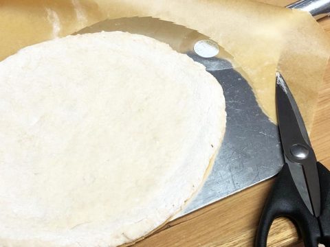 Parchment Cutting Around Gluten Free Pizza Dough