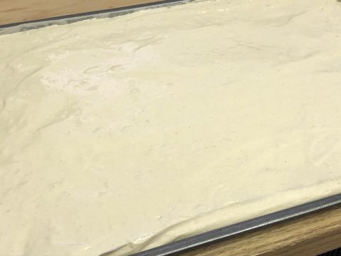 Gluten Free Sponge Cake Batter in Lined Baking Sheet