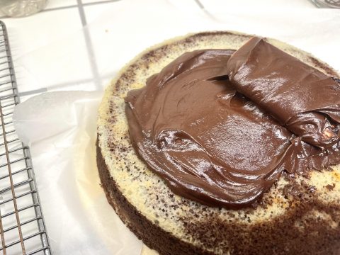 Chocolate Frosting Over a Layer of Gluten Free Zebra Cake